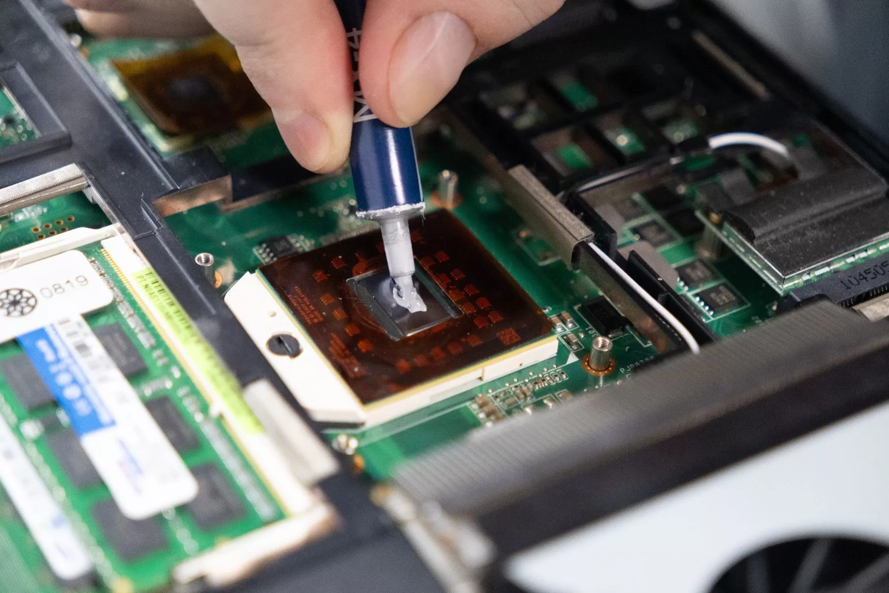 Applying Thermal Paste on a Laptop Processor for Heat Management